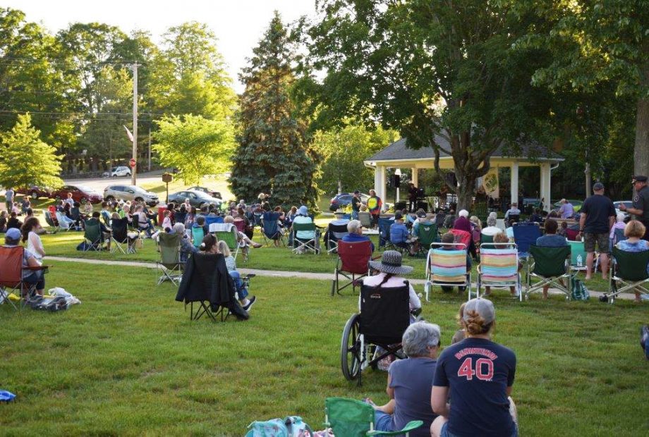 People on the Sturbridge Common enjoying some entertainment